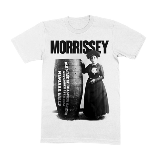 Morrissey lady standing next to large tire Niagra Falls