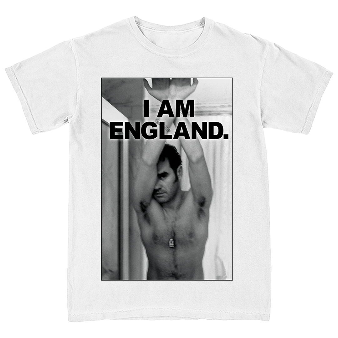 A white short-sleeve crewneck t-shirt featuring a large black-and-white graphic print on the front. The print shows a shirtless man with his arms raised, with bold black text reading 'I AM ENGLAND.