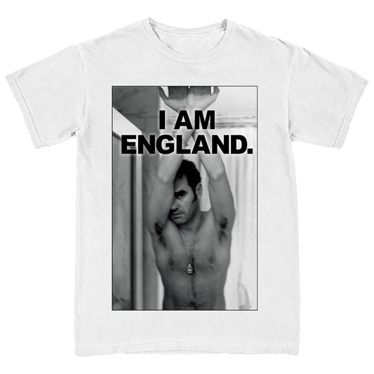 A white short-sleeve crewneck t-shirt featuring a large black-and-white graphic print on the front. The print shows a shirtless man with his arms raised, with bold black text reading 'I AM ENGLAND.