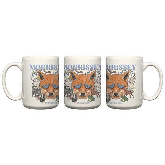 Three white ceramic mugs shown side by side on a plain white background, each printed with a fox illustration and the name MORRISSEY in blue text.