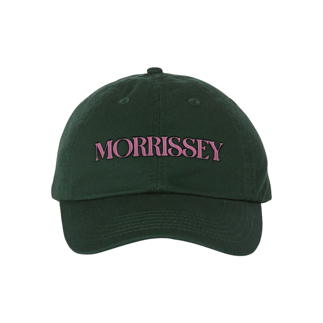 A dark green cotton baseball cap with 'MORRISSEY' embroidered in pink across the front, shown against a plain white background.