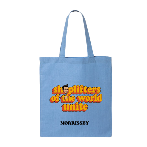 A light blue canvas tote bag with two shoulder straps, featuring a retro-style graphic that reads 'shoplifters of the world unite' in orange and yellow bubble letters with a cartoon face, and the name 'MORRISSEY' printed below in black.