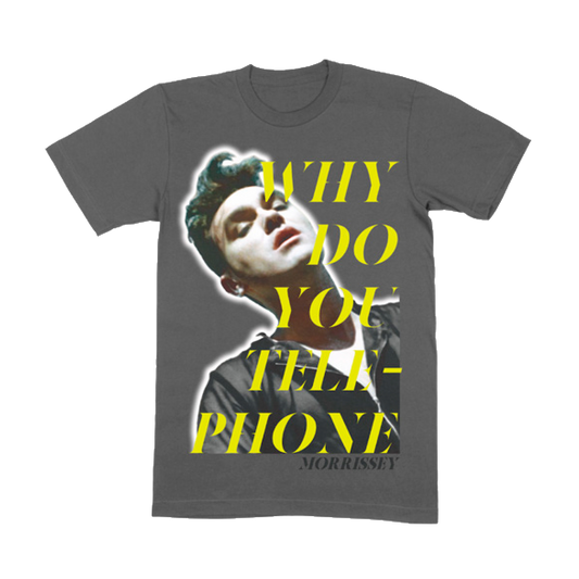 A charcoal gray t-shirt with a graphic print of a person and the text 'WHY DO YOU TELEPHONE MORRISSEY' in a bold, yellow font.